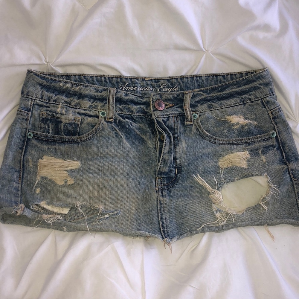 Destroyed light jean mini skirt
